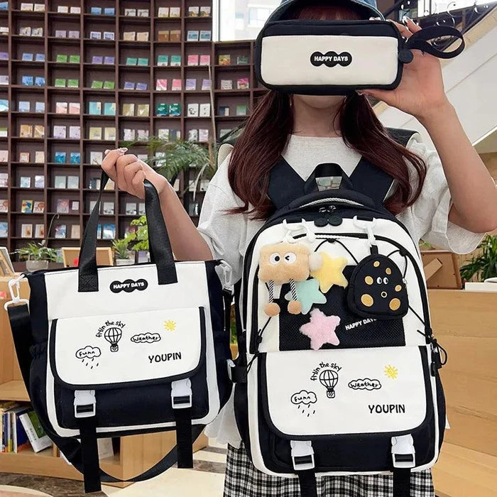 Black-and-white 3-piece backpack set with character backpack, small tote bag, and zip pouch.