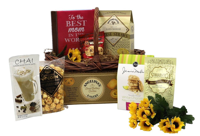 Wicker gourmet gift basket with assorted treats, boxes, and yellow flowers
