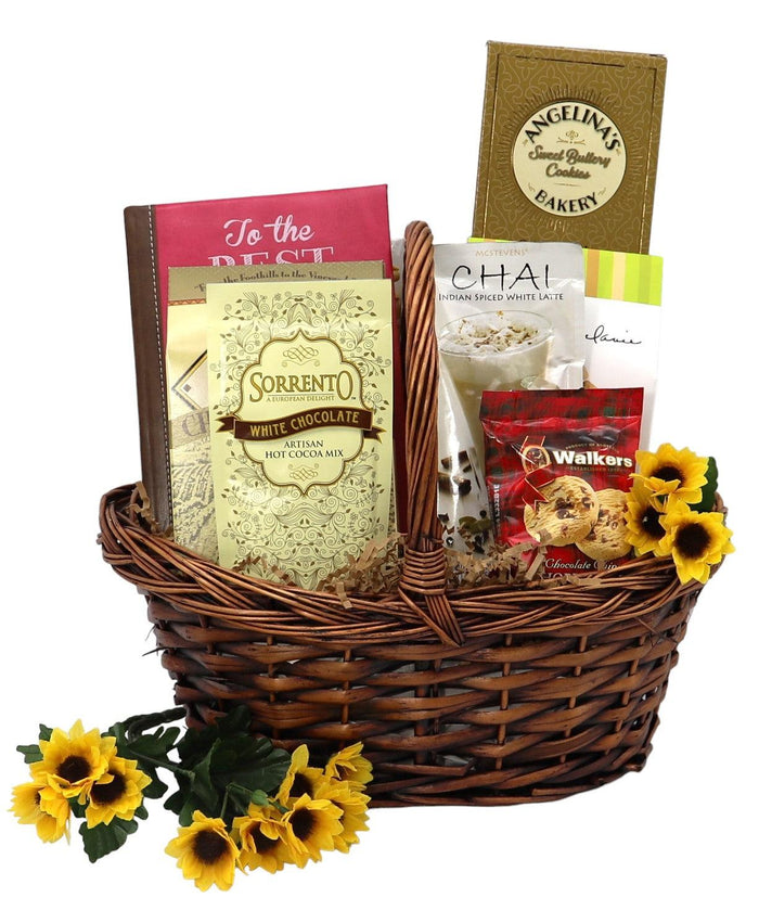 Wicker gift basket with white chocolate, chai packets, and yellow flowers
