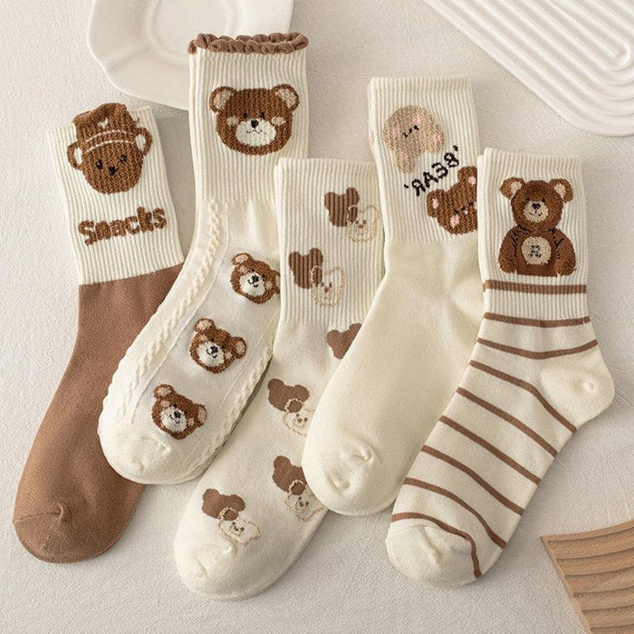 Mixed teddy bear sock set: white, brown, and striped styles with bear faces and hearts.