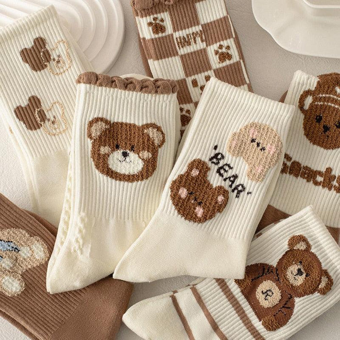 Teddy bear crew socks with white and brown stripes and cartoon bear faces