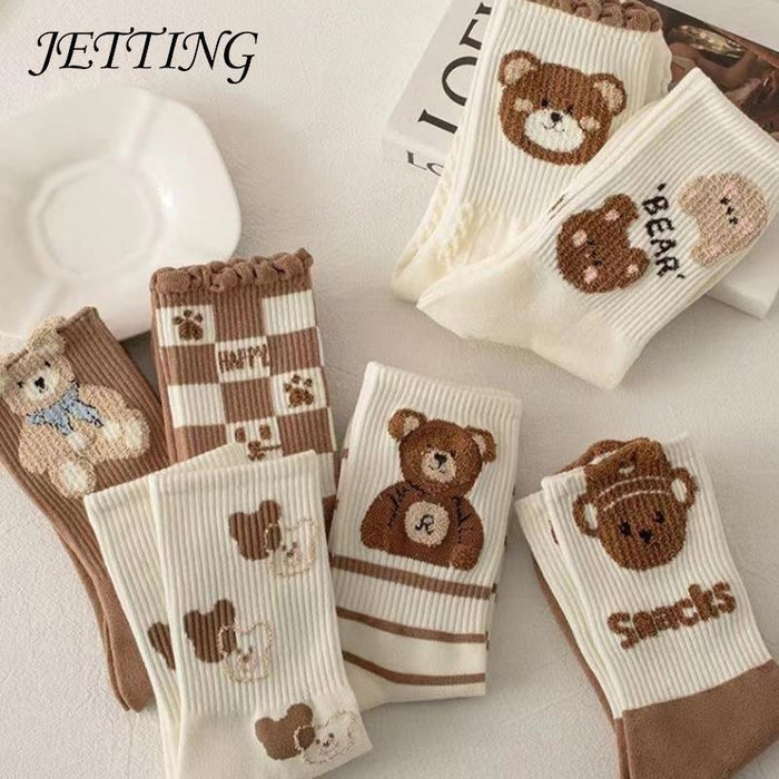 Set of teddy bear crew socks in white and brown with striped cuff details