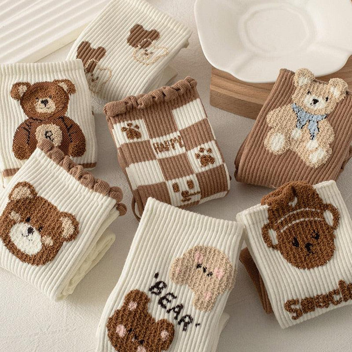 Teddy bear crew socks with knit ribbed texture, bear portraits, and striped patterns
