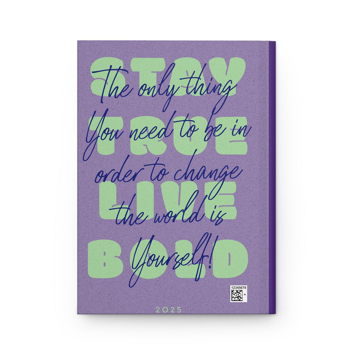 Hardcover journal with purple cover, green slogan text, and barcode/QR code at bottom.