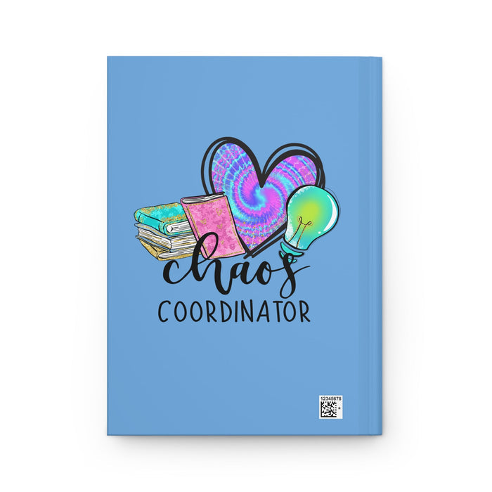 Blue matte hardcover journal front with 'Chaos Coordinator' text and small barcode