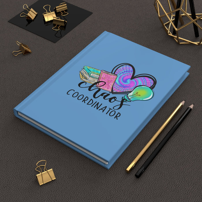 Blue matte hardcover journal with colorful heart and 'Chaos Coordinator' cover artwork
