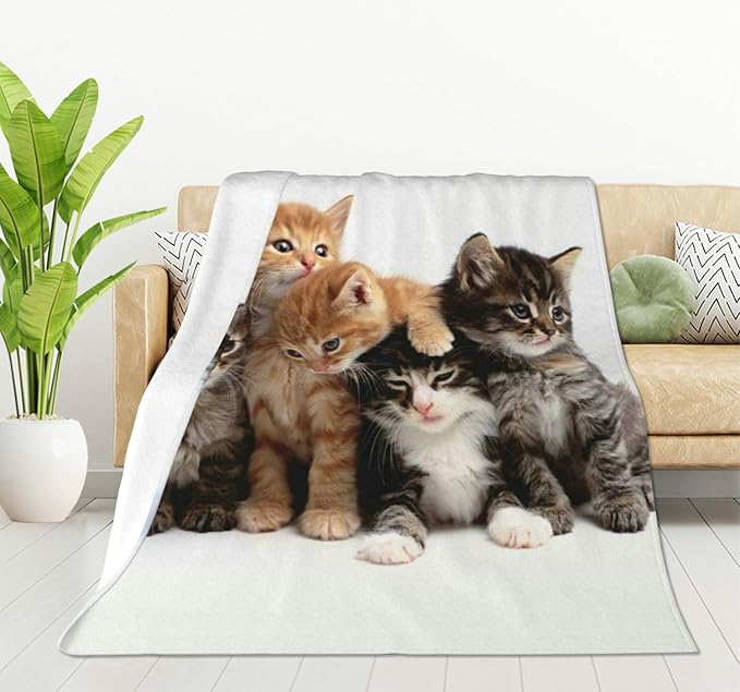 Cats throw blanket in white fleece with a group of kitten portraits and a draped edge