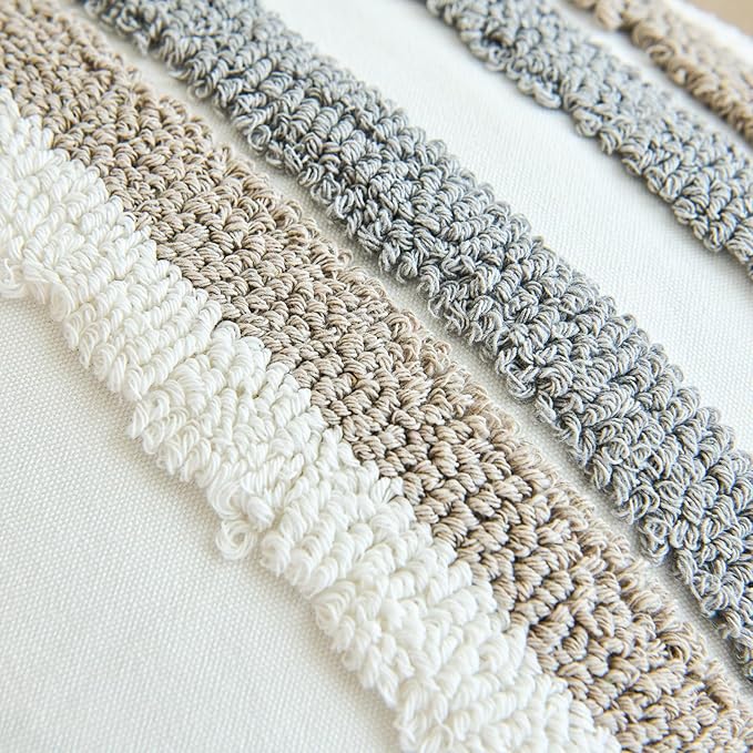 Close-up textured crochet pillow cover stripes in white, beige, and gray
