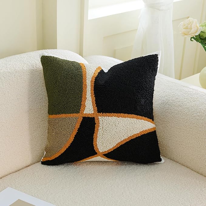 Square tufted pillow cover set with green, black, tan geometric cross and orange trim