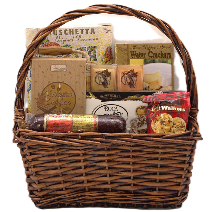 Wicker gift basket with assorted snacks, crackers, biscuits, and coffee/tea items
