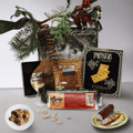 Holiday gift box with assorted snack packages and pine decor, open tray view