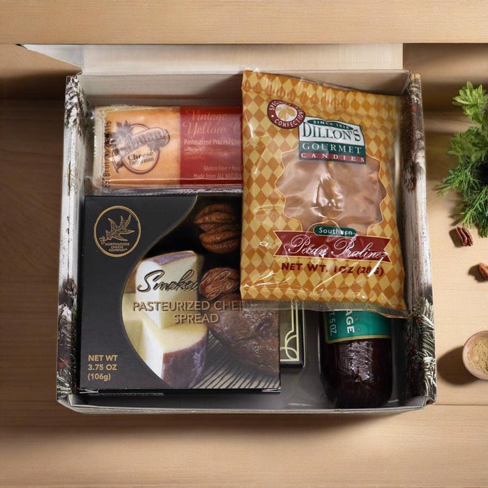 Open holiday gift box with smoked cheese, crackers, and cured meat packages