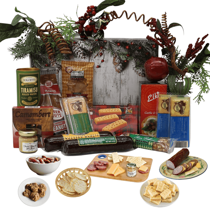 Holiday gift box with assorted deli and snack foods, decorated with pine branches