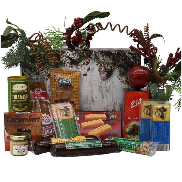 Holiday gift box filled with assorted gourmet foods, pine-branch lid with red berries