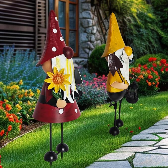 Outdoor metal gnome statues: red-hat and yellow-hat with white beards and black boots