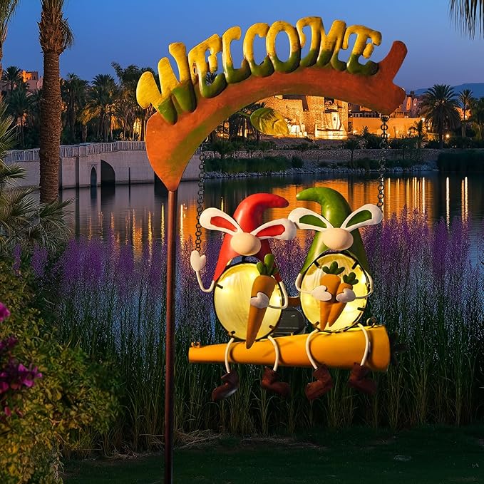 Solar swing garden light with two 3D rabbits on chains beneath a brown welcome arch, glowing