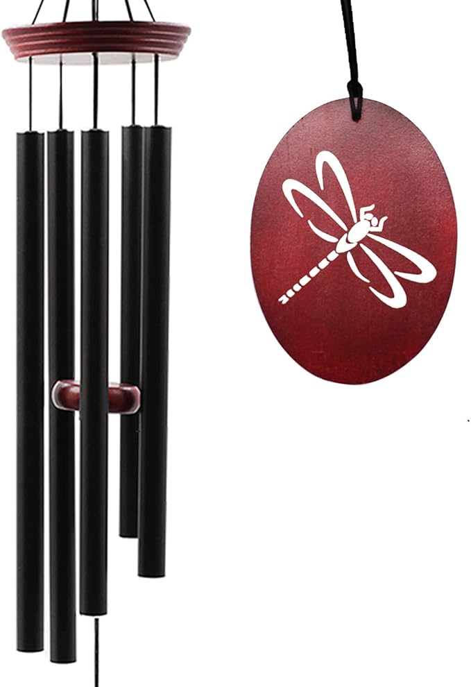 Outdoor wind chime with five black tubes and red dragonfly disc, hanging on hook.