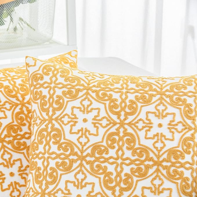 Mustard yellow and white embroidered damask throw pillow cover close-up