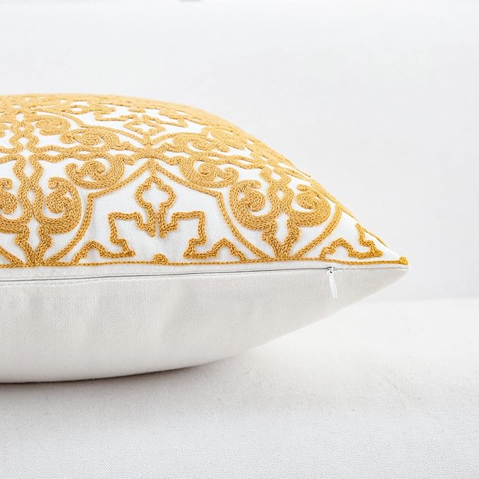 Mustard yellow embroidered throw pillow cover with stitched border edge