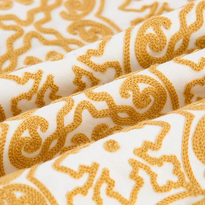 Mustard yellow and white embroidered damask throw pillow cover fabric close-up