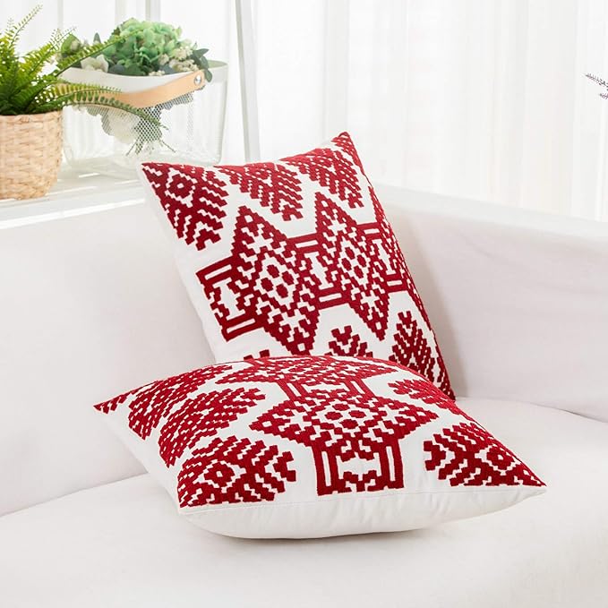 Red diamond-pattern throw pillow cover with embroidered farmhouse style design