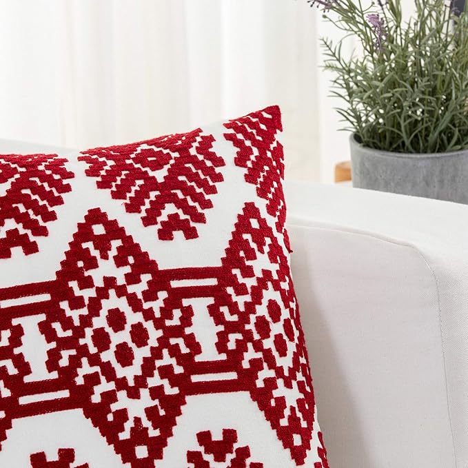 Close-up of red and white diamond embroidered pillow cover