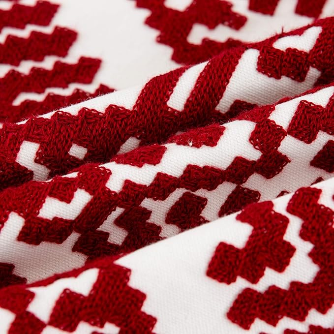 Close-up fabric texture of red and white diamond embroidery on throw pillow cover