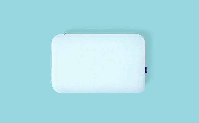 Casper's Hybrid Snow Pillow against an aqua background