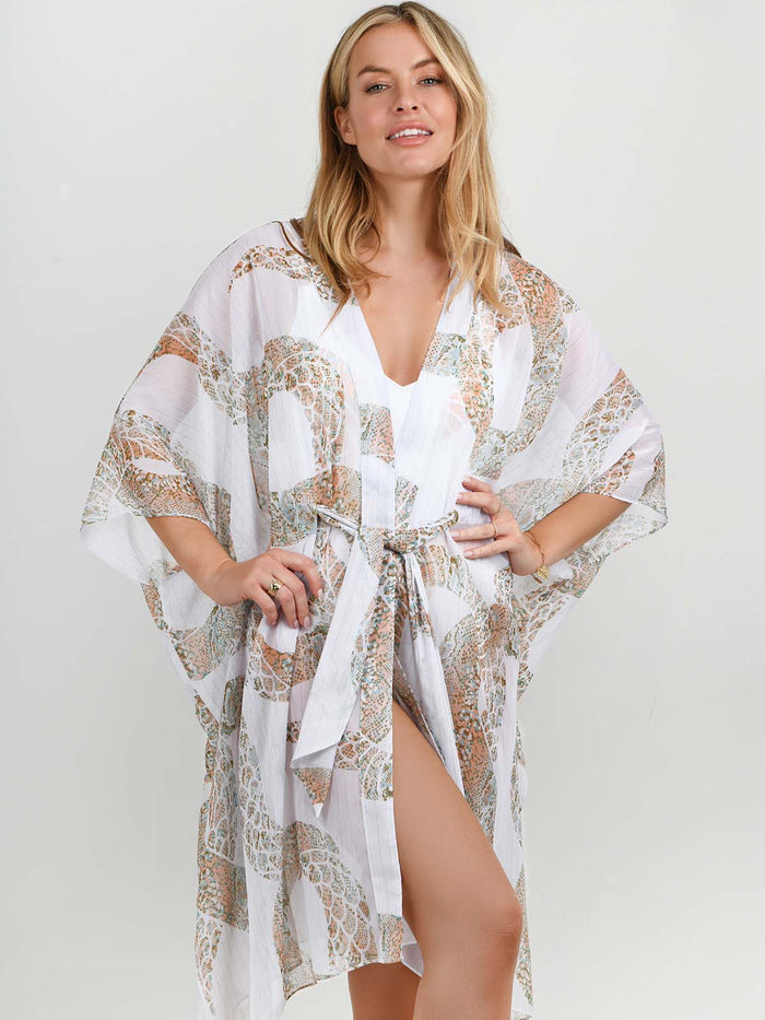 Model wearing the Ibiza Snake swimsuit and kaftan by NAIA Beach