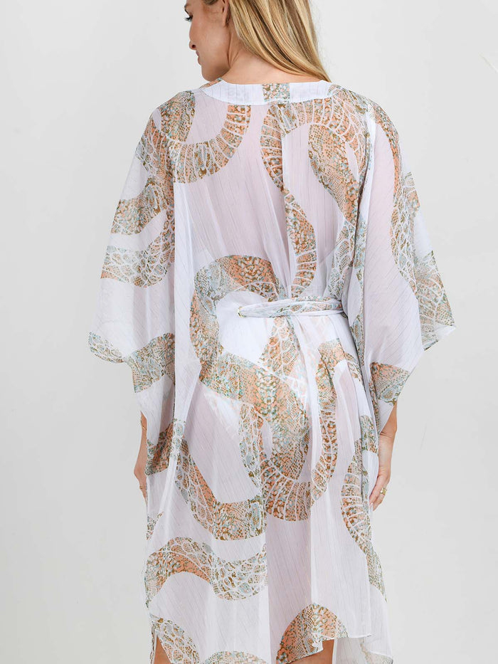 Model wearing the Ibiza Snake swimsuit and kaftan by NAIA Beach