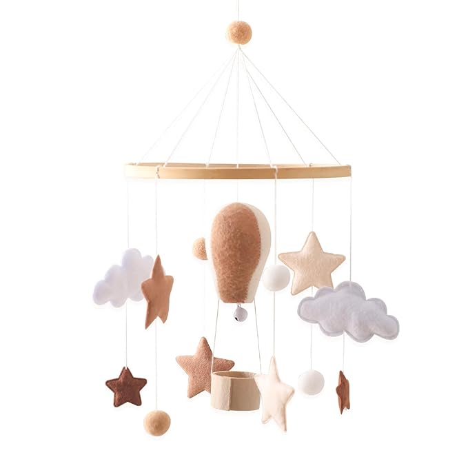 Boho nursery crib mobile with hot air balloon, stars, clouds, and hanging felt shapes