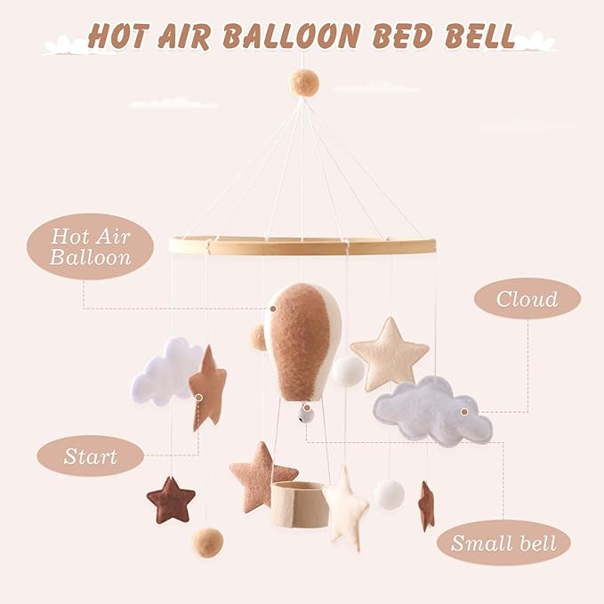 Hot air balloon baby crib mobile featuring cloud and star ornaments on hanging strings