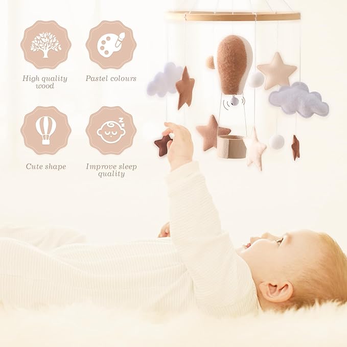 Crib mobile decor with felt hot air balloon and star-and-cloud hanging pieces
