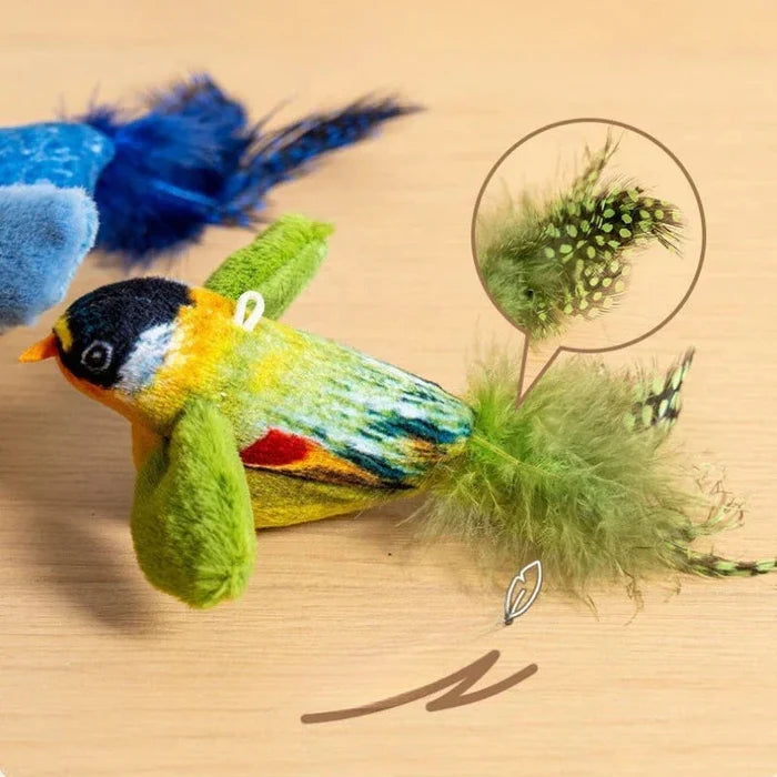 Feathered plush bird cat toy with blue and green wings and coiled spring tether
