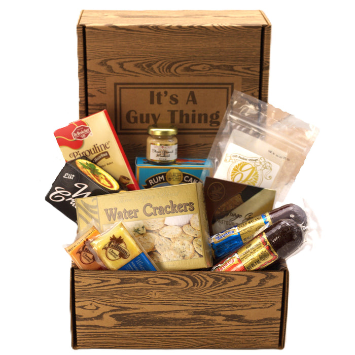 Open wooden gift box with Guy Thing label and assorted snack packs