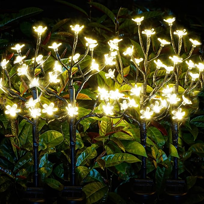 Solar flower garden lights, four black branch stakes with warm white glowing LED petals