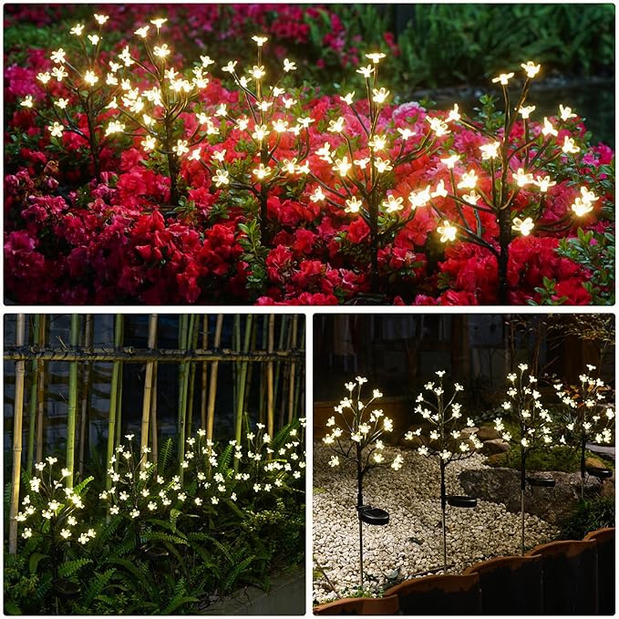 Solar flower garden lights, warm white LED blossoms illuminating red and pink flowering bushes