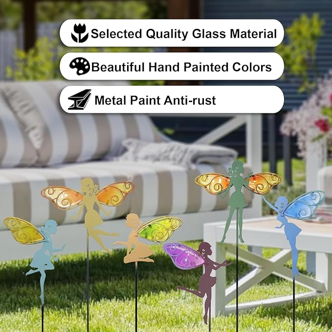 Multicolor fairy garden stakes with decorative glass wing details in lawn