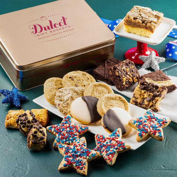 Patriotic decorated cookies on a white tray beside a metal gift tin