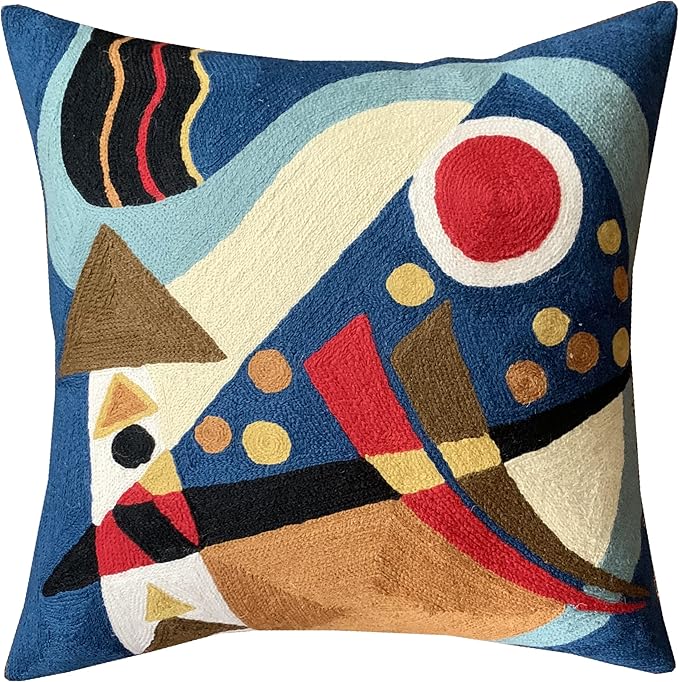 Blue abstract geometric pillow cover with red circle, cream curves, and yellow dots