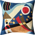 Blue abstract geometric pillow cover with red circle, cream curves, and yellow dots
