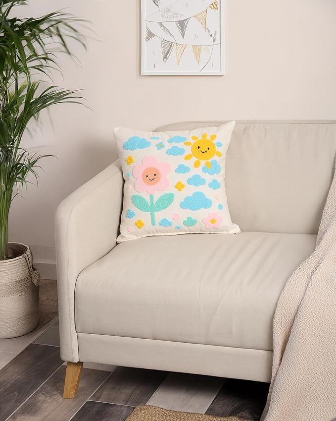 Handmade throw pillow cover with sun and clouds motif on a light background