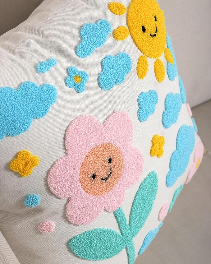 Handmade cotton throw pillow cover close-up: yellow sun, pink flower, and blue clouds