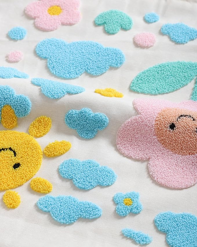 Handmade cotton throw pillow cover with scattered clouds, flowers, and sun accents