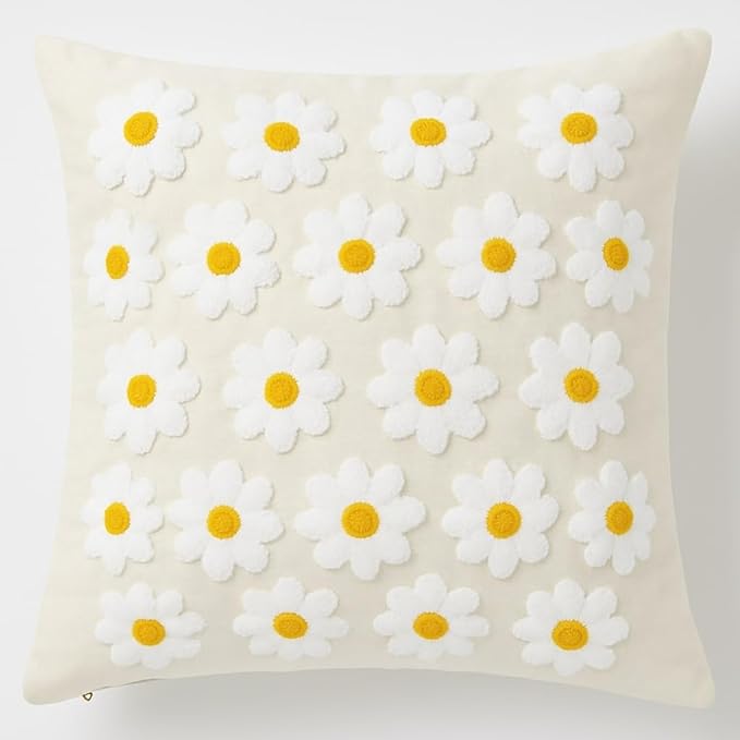 Natural cotton daisy throw pillow cover with white petals and yellow centers, textured stitch