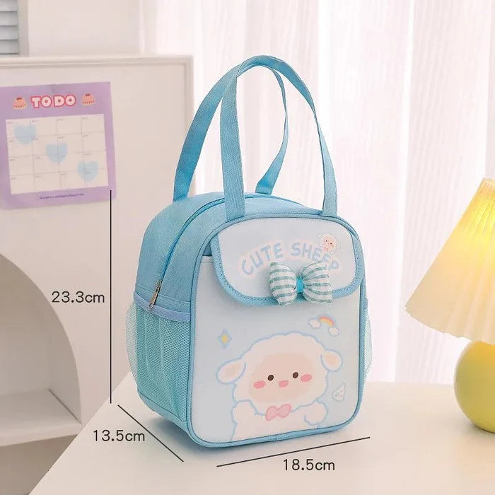 Blue insulated animal lunch bag with bow front pocket and sheep illustration, size diagram shown