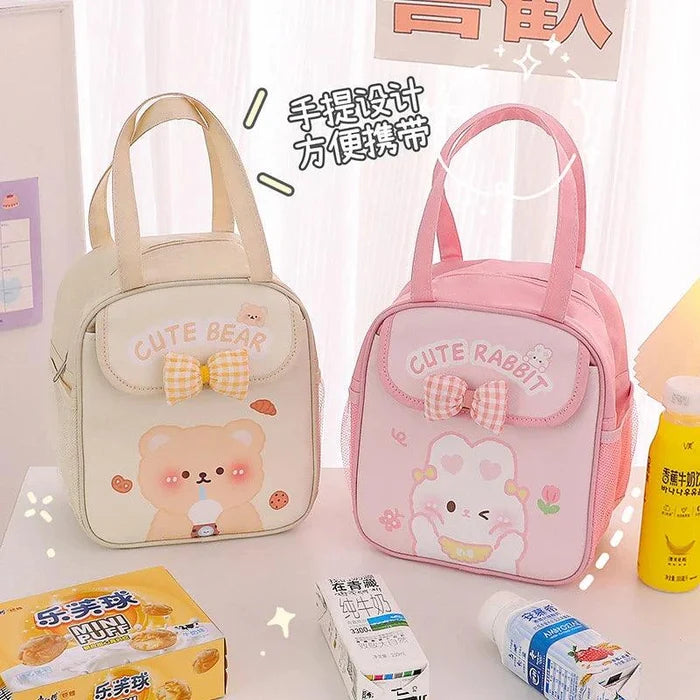 Pair of insulated animal lunch bags, cream and pink with bow front pockets and handles