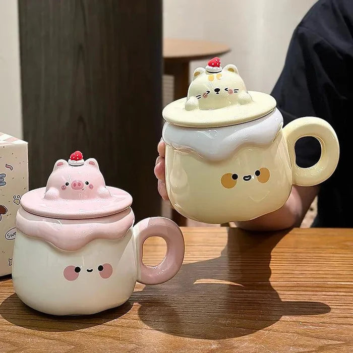 Two ceramic animal pudding mugs with lids: pink pig and yellow cat with strawberry topper