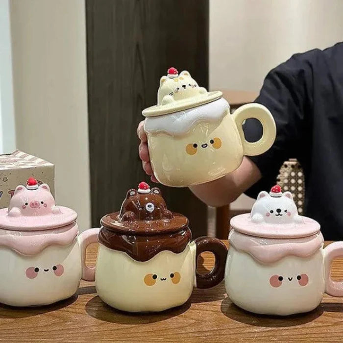 Ceramic animal pudding mugs set: yellow cat, brown bear, and white cat with strawberry lids