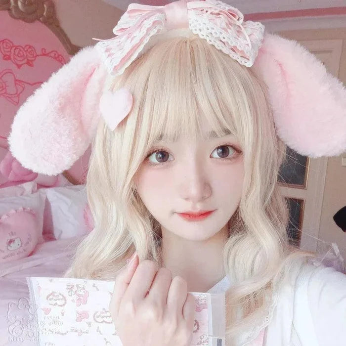 Bunny ears headband with pink bow and white plush ears, lace trim